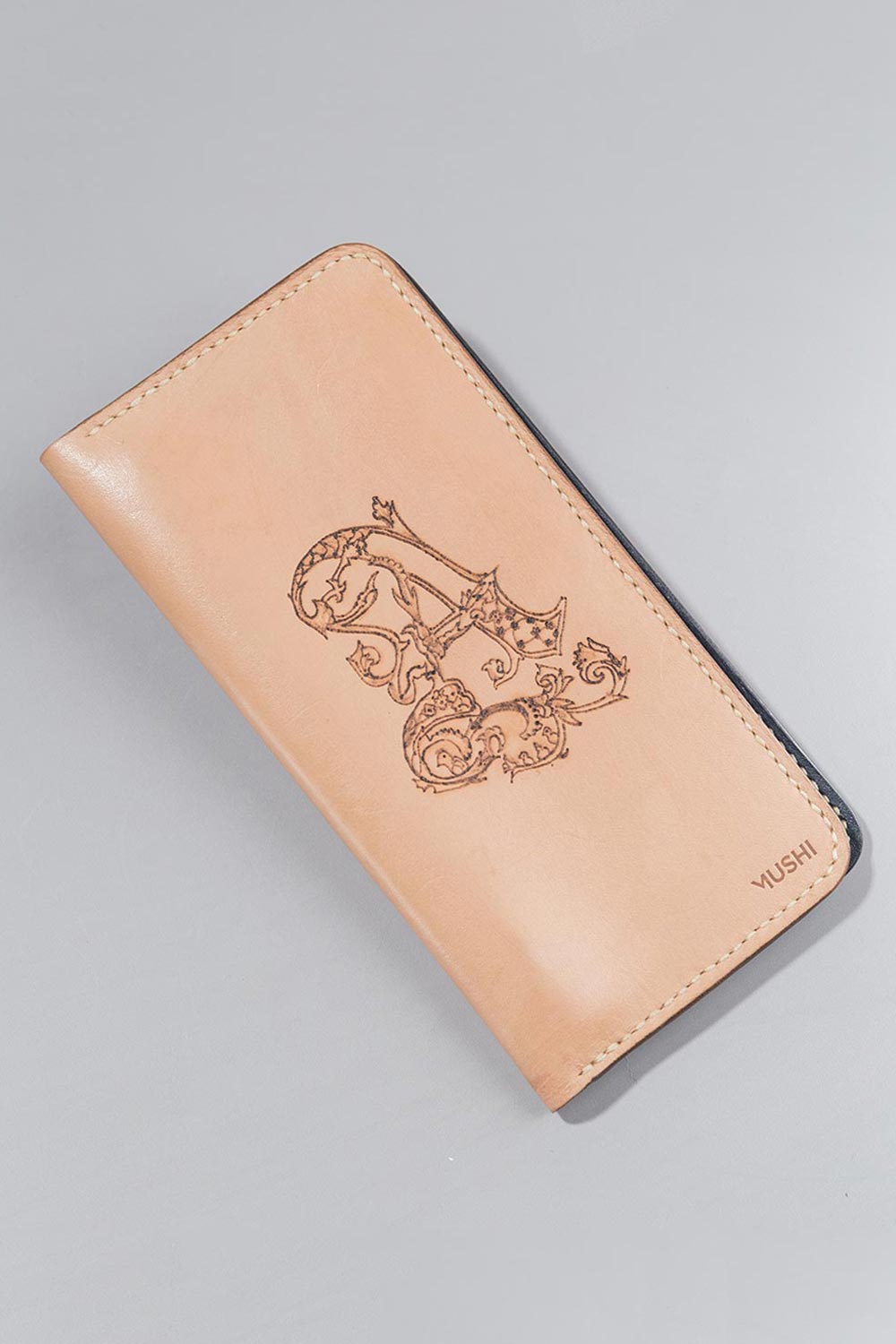 Imported genuine long leather wallet in nude with letter A decorative painting in Pakistan.
