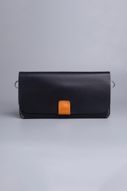 Carry on leather wallet with shoulder strap in black in Pakistan.
