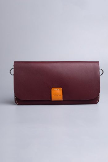 Carry on leather wallet with shoulder strap in burgundy in Pakistan.