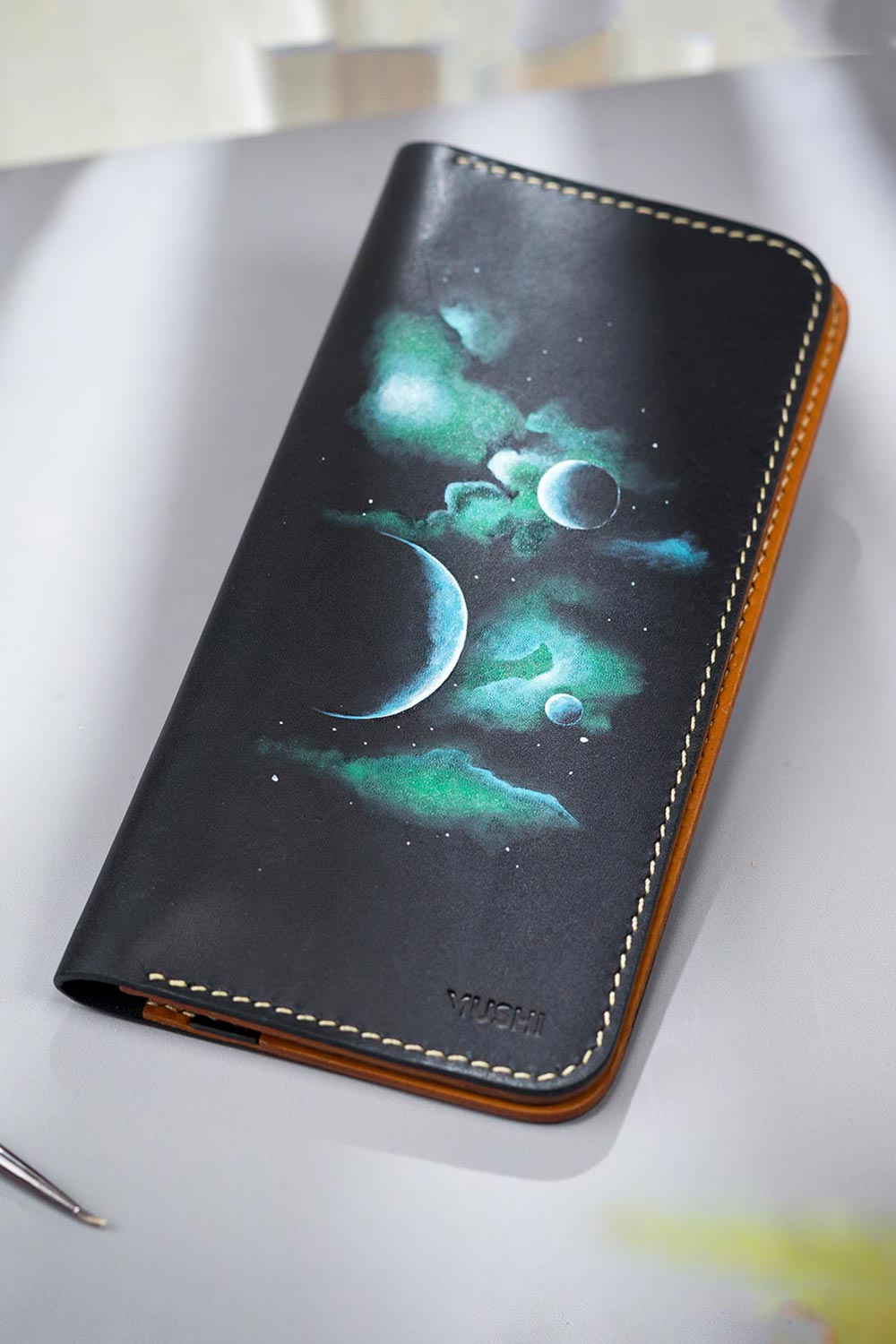 EXPANDING-UNIVERSE-FOOTER-IMAGE-TWO Imported genuine long leather wallet in black with planets and clouds painting in Pakistan.