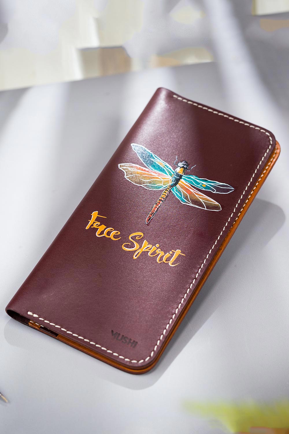 Imported genuine long leather wallet in burgundy with dragonfly painting in Pakistan.