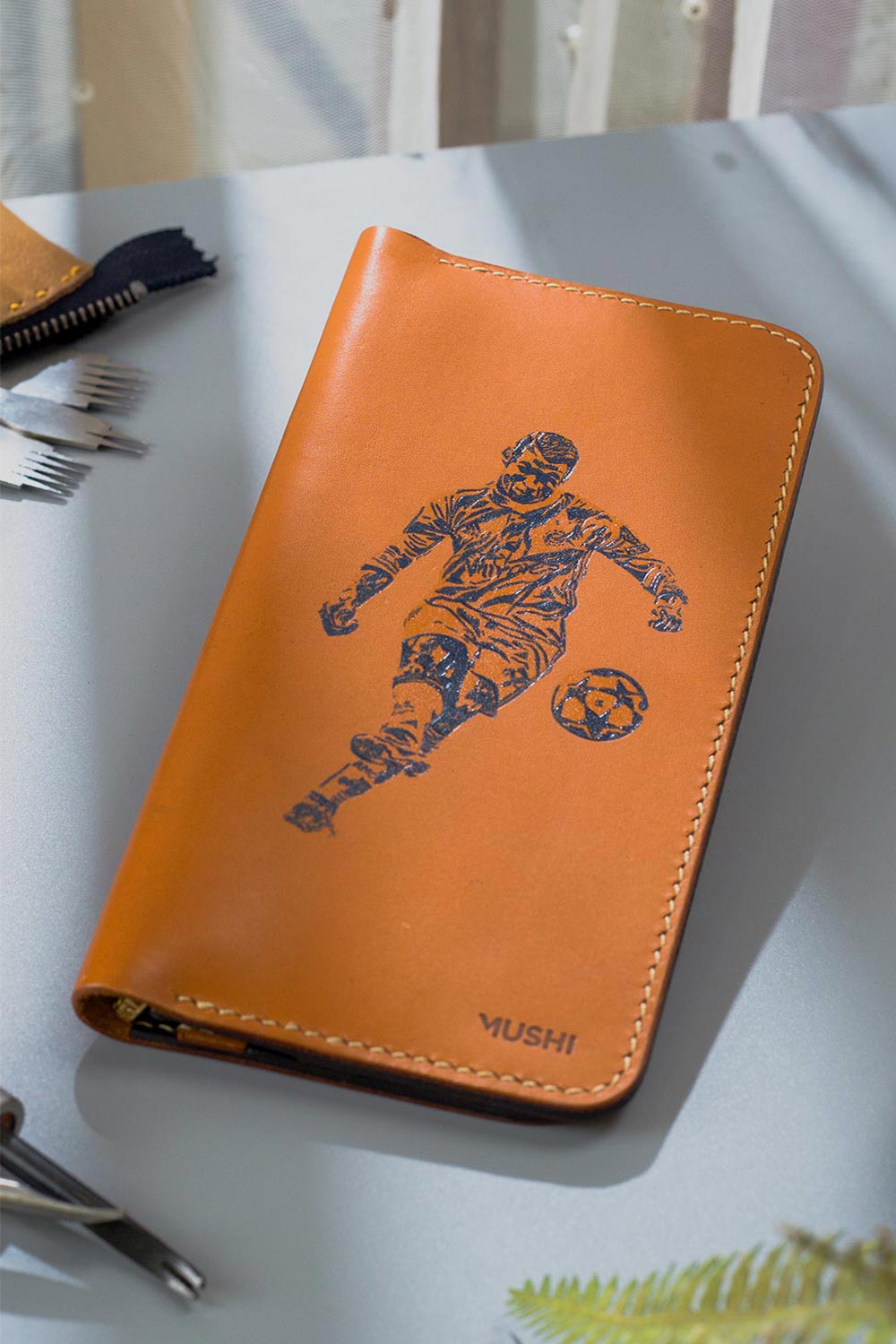 Imported genuine long leather wallet in beige with bicycle rider painting in Pakistan.