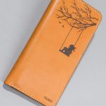Imported genuine long leather wallet in beige with girl on a swing painting in Pakistan.
