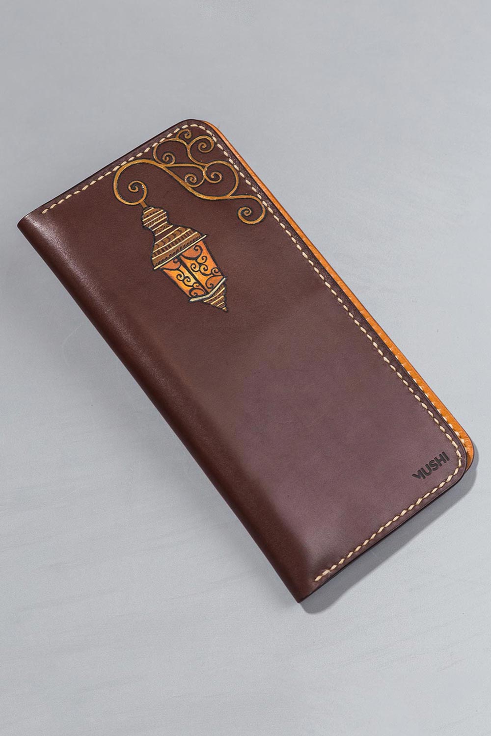 THE-LANTERN-VISION-FOOTER-IMAGE-TWO Imported genuine long leather wallet in burgundy with lantern painting in Pakistan.