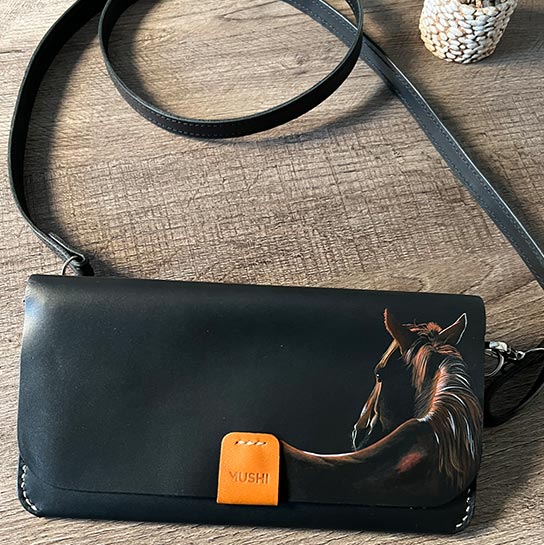 Carry-On-Wallets-Imagge-Five Carry on leather wallet with shoulder strap in black with stallion painting in Pakistan.