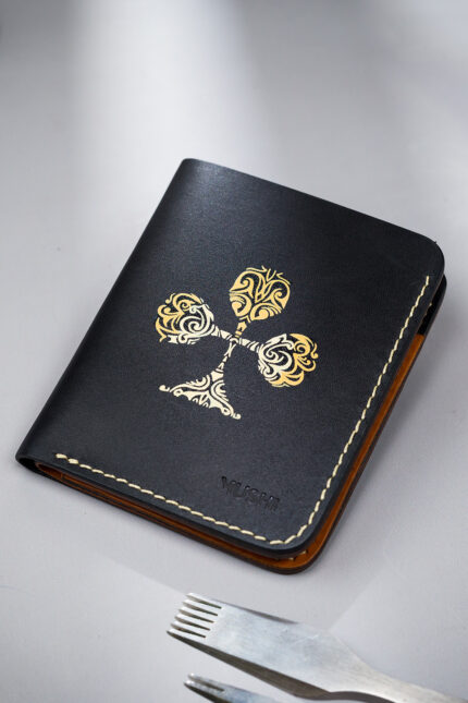 Black vegetable-tanned leather with a club abstract design.