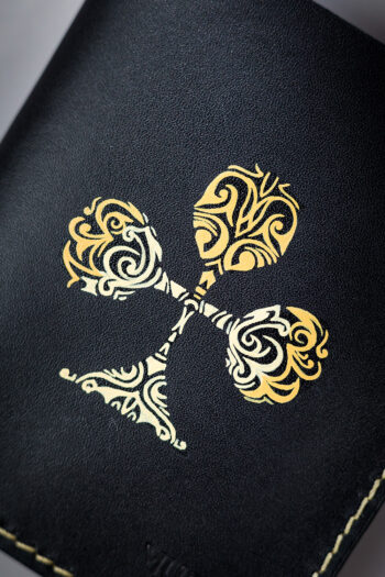 Black vegetable-tanned leather with a club abstract design.