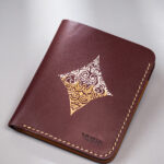 Burgundy vegetable-tanned leather with a diamond abstract design.