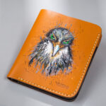 Genuine minimalist leather wallet with pull-out strap in beige with hawk painting in Pakistan.