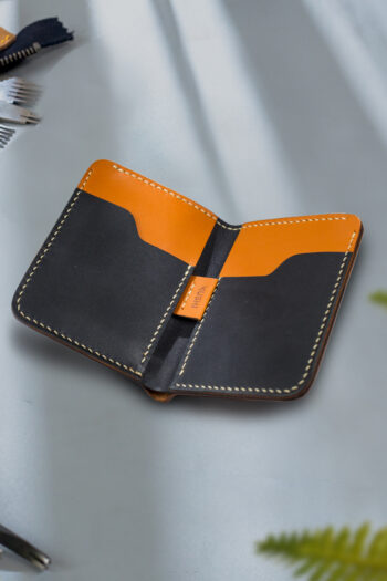 Genuine minimalist leather wallet with pull-out strap in beige with hawk painting in Pakistan.