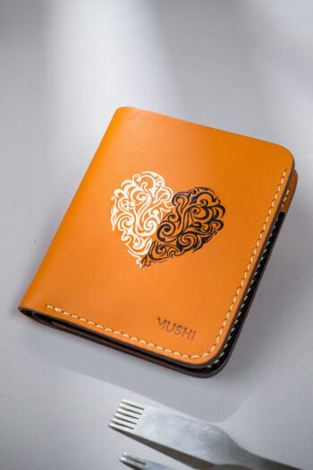Beige vegetable-tanned leather with a heart abstract design.