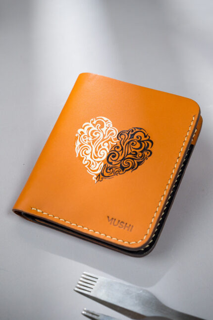 Beige vegetable-tanned leather with a heart abstract design.