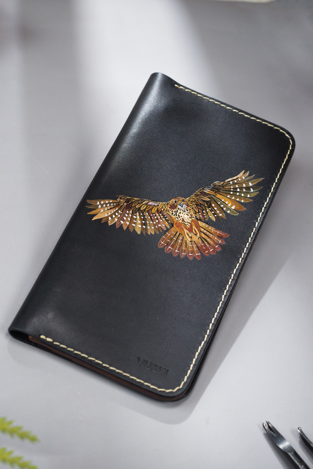 Owl's Wingspan-Featured-Image Imported genuine long leather wallet in black with owl flying painting in Pakistan.