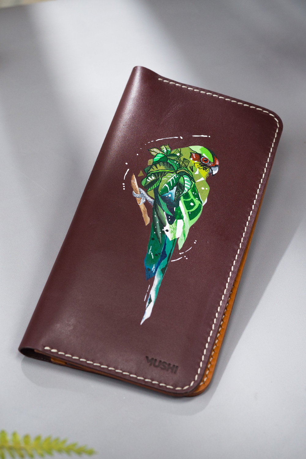 Radiant-Parrot-Featured-Image Imported genuine long leather wallet in burgundy with green parrot painting in Pakistan.