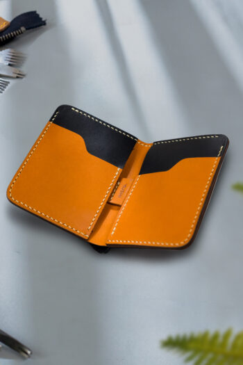 Black vegetable-tanned leather with a spade abstract design.