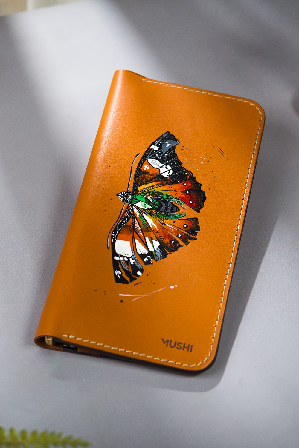 Vibrant Butterfly-Featured-Image Imported genuine long leather wallet in beige with colourful butterfly painting in Pakistan.
