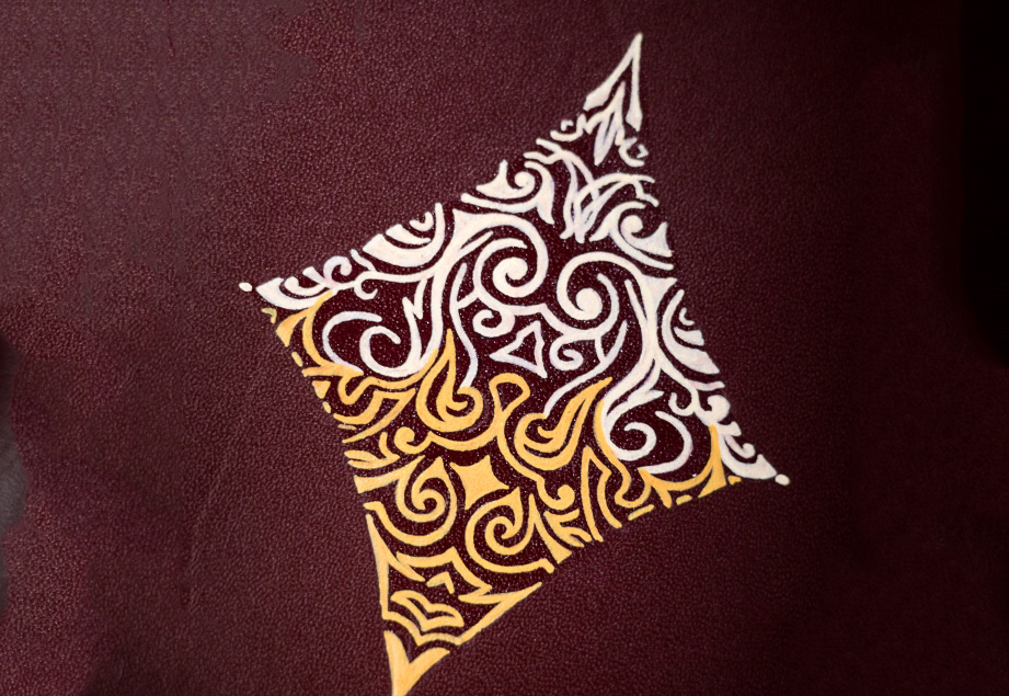 Burgundy vegetable-tanned leather with a diamond abstract design.