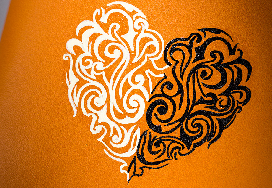 Beige vegetable-tanned leather with a heart abstract design.