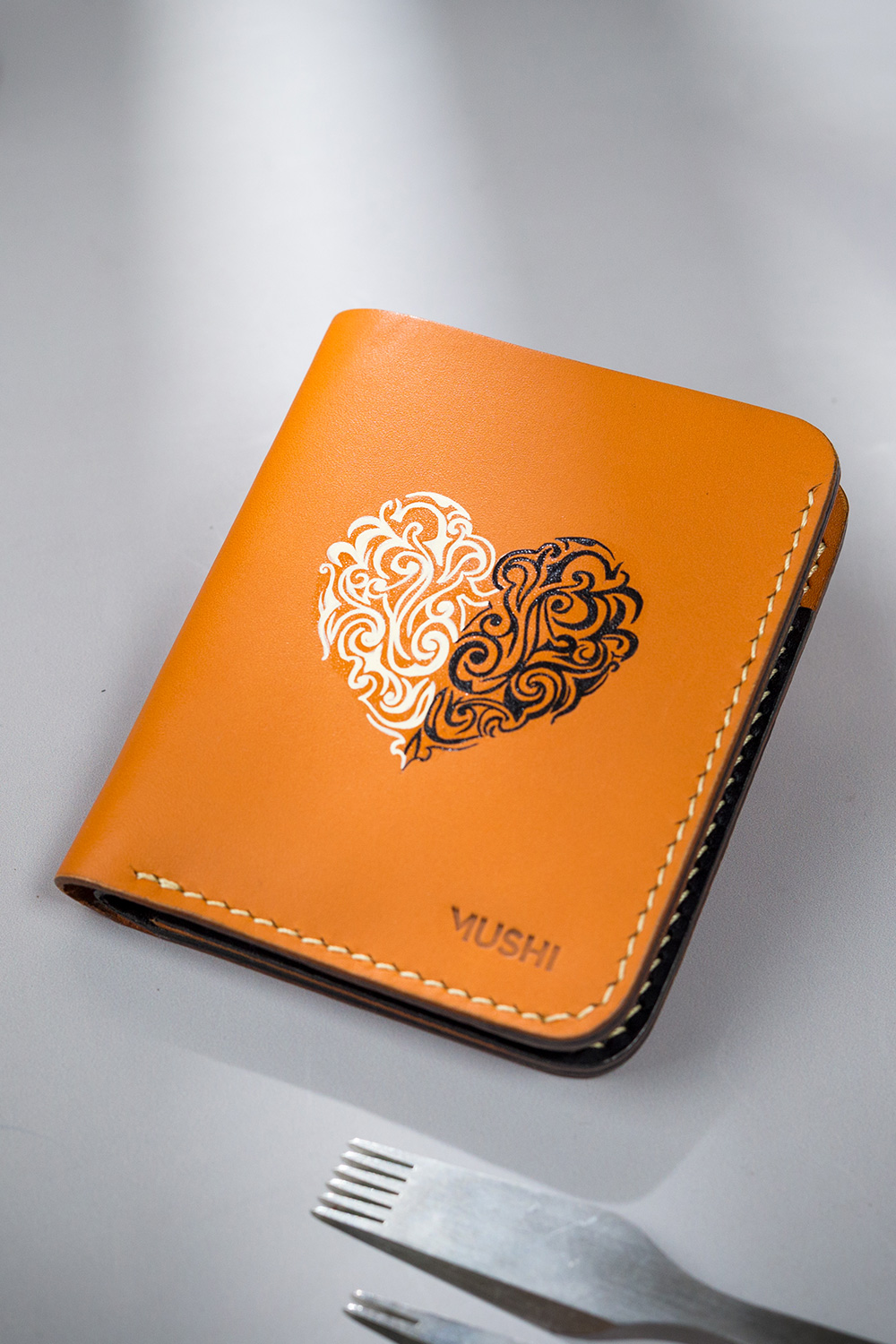 Beige vegetable-tanned leather with a heart abstract design.