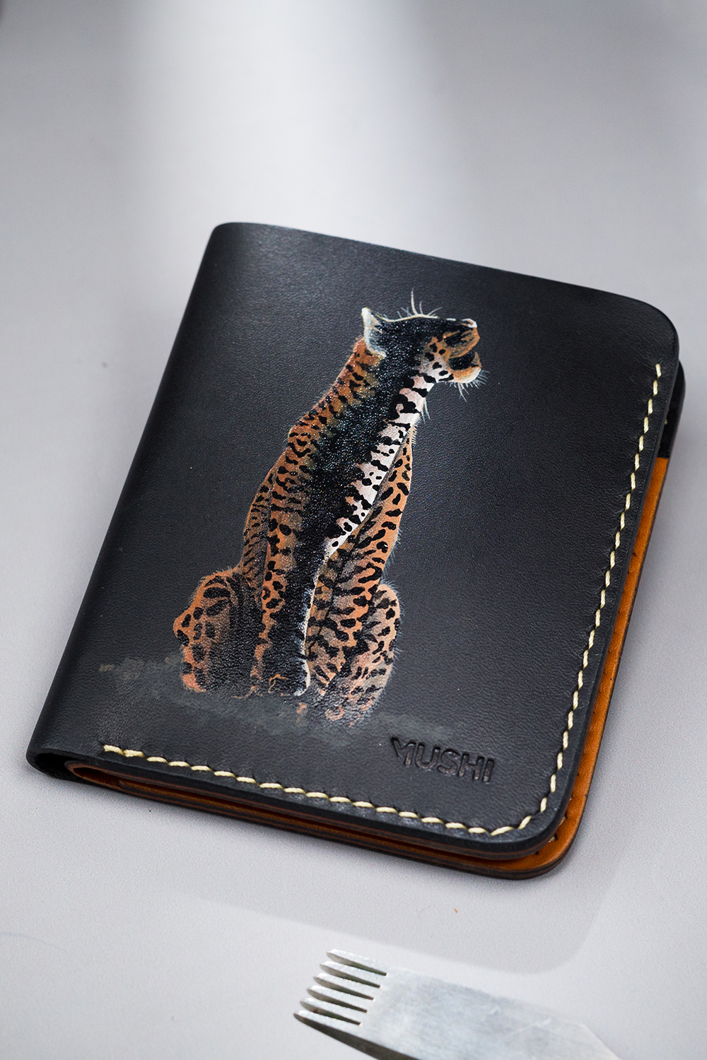 THE-GROWL-FOOTER-IMAGE-TWO Genuine leather minimalist wallet with leopard painting, 4 slots and pull-out strap in Pakistan