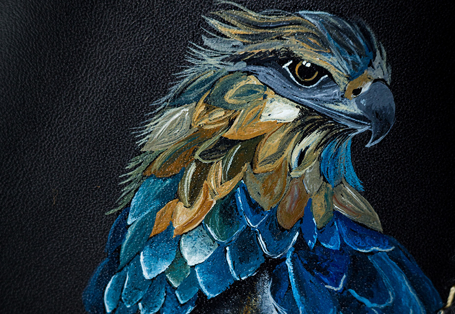 Genuine minimalist leather wallet with pull-out strap in black with eagle painting in Pakistan.