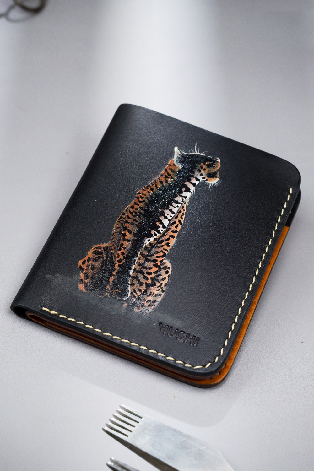The-Growl-Featured-Image Genuine leather minimalist wallet with leopard painting, 4 slots and pull-out strap in Pakistan
