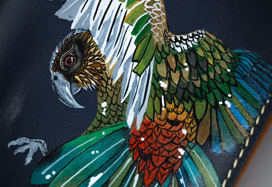 VIBRANT-BIRD--FOOTER-IMAGE-ONE Imported genuine long leather wallet in black with colourful bird illustration in Pakistan.