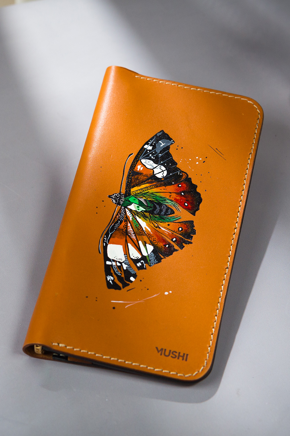 VIBRANT-BUTTERFLY-FOOTER-IMAGE-TWO Imported genuine long leather wallet in beige with colourful butterfly painting in Pakistan.