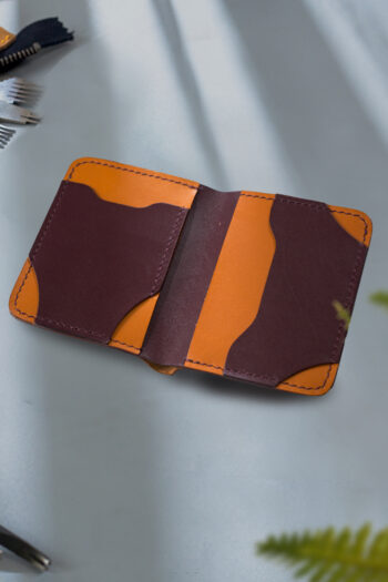 Pure handmade orange and bugundy Leather Wallet stitching by Hands