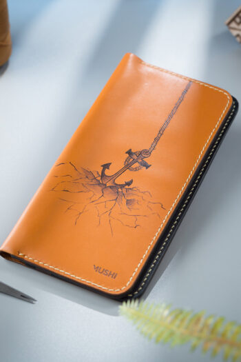 Creative Art on MUSHI Wallet in Pakistan featuring Sea Anchor Concept when submerged in Ocean Cracking the Earth surface.